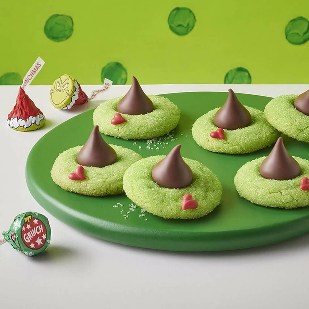 plate of grinch themed blossom cookies