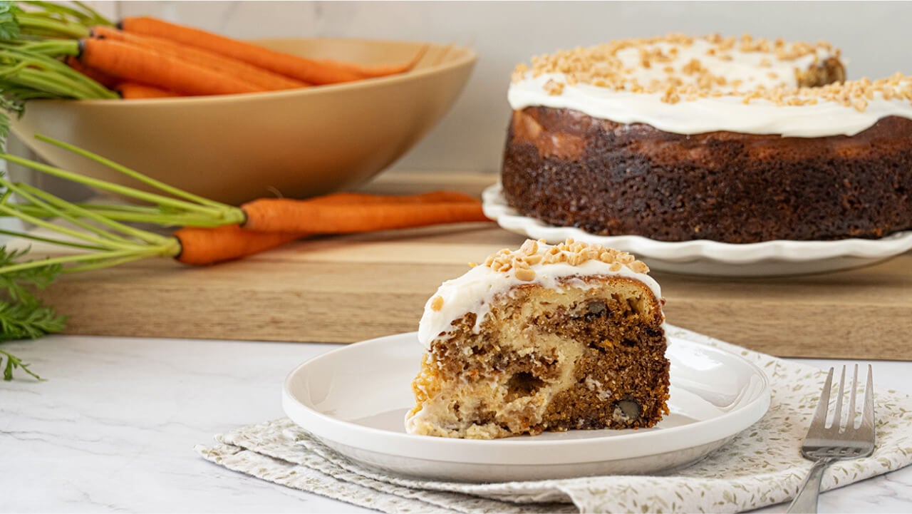carrot bake beside basket full of fresh carrots
