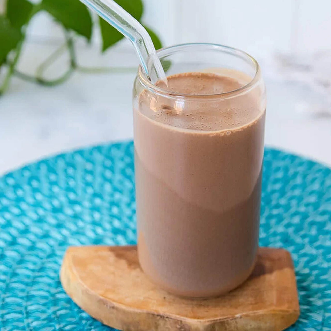 chocolate protein shake on wooden coaster