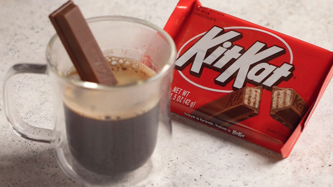 kit kat bar dipped in a cup of espresso