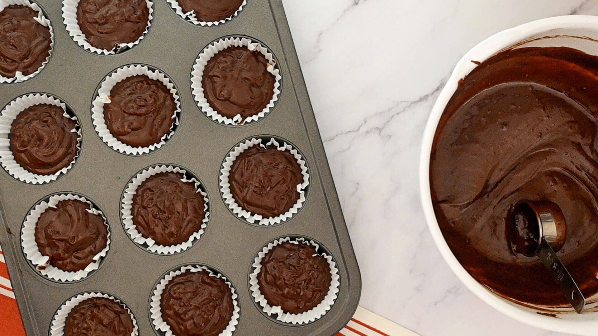 batter divided evenly in prepared muffin cups