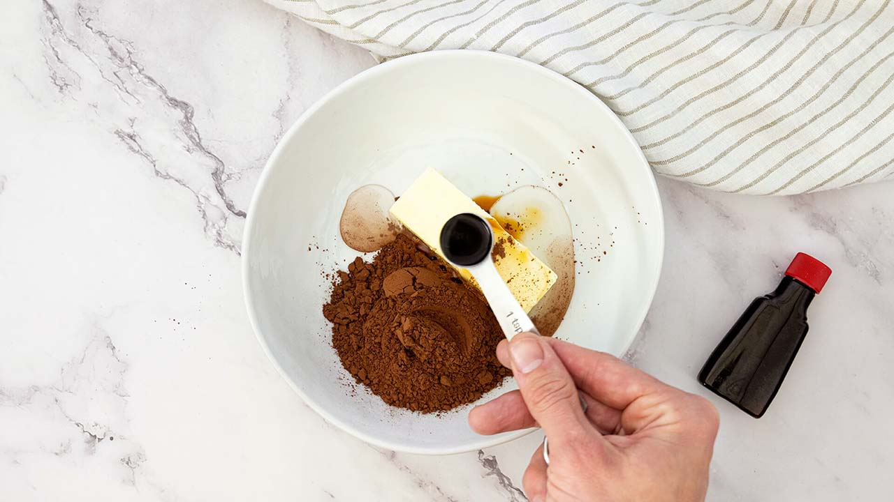 mixing and blending dry and wet ingredients together in a small bowl