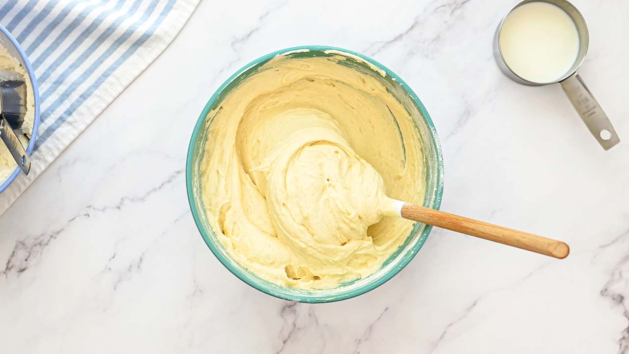 adding flour and milk into the wet ingredient mixture