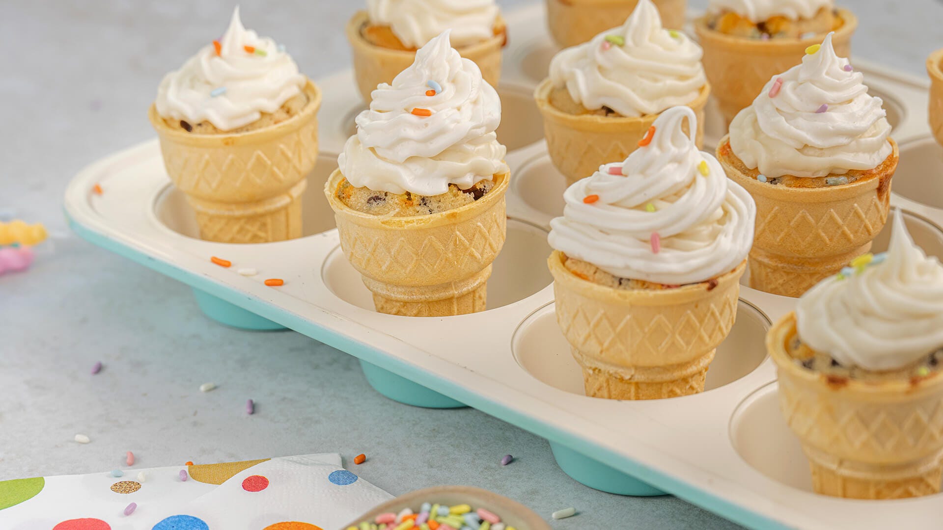 muffin tin full of ice cream cone cupcakes