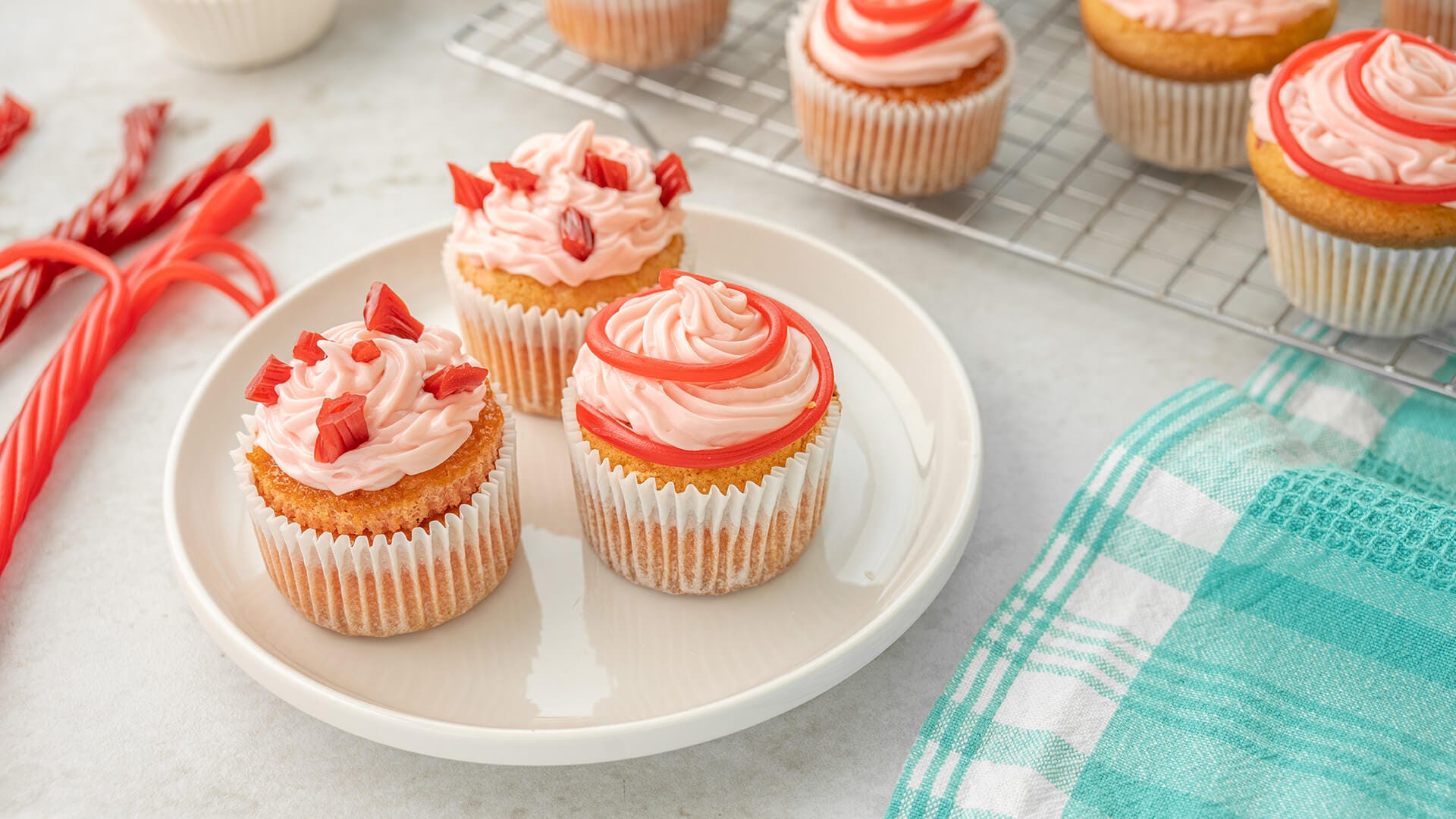 three plated twizzlers strawberry cupcakes