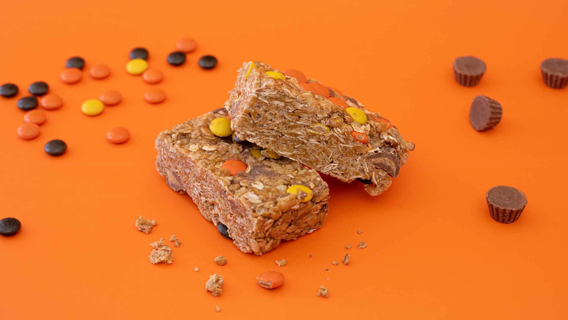 reeses peanut butter granola bars beside reeses pieces and miniature peanut butter cups