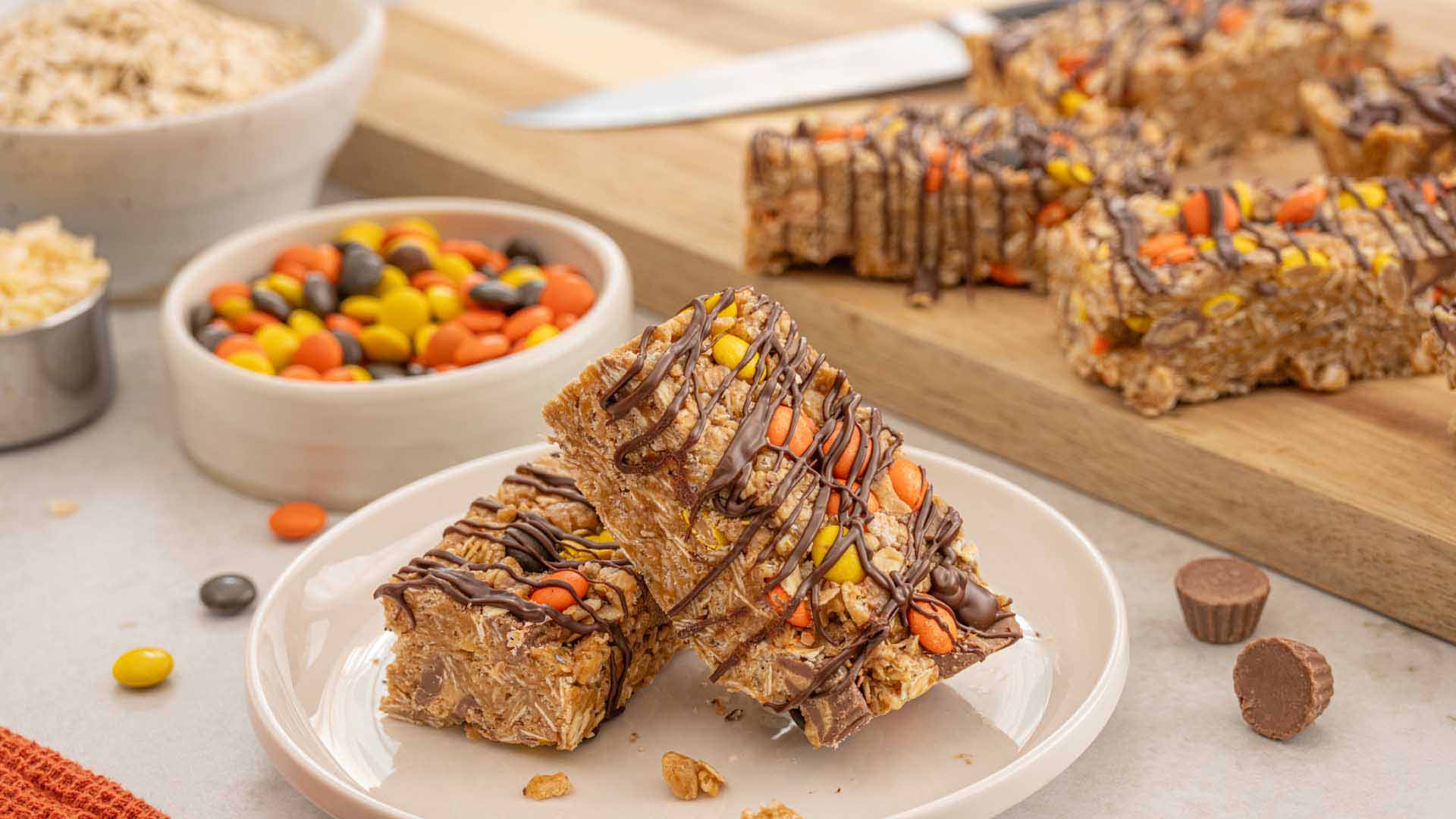 cutting up tray of reeses peanut butter granola bars to serve