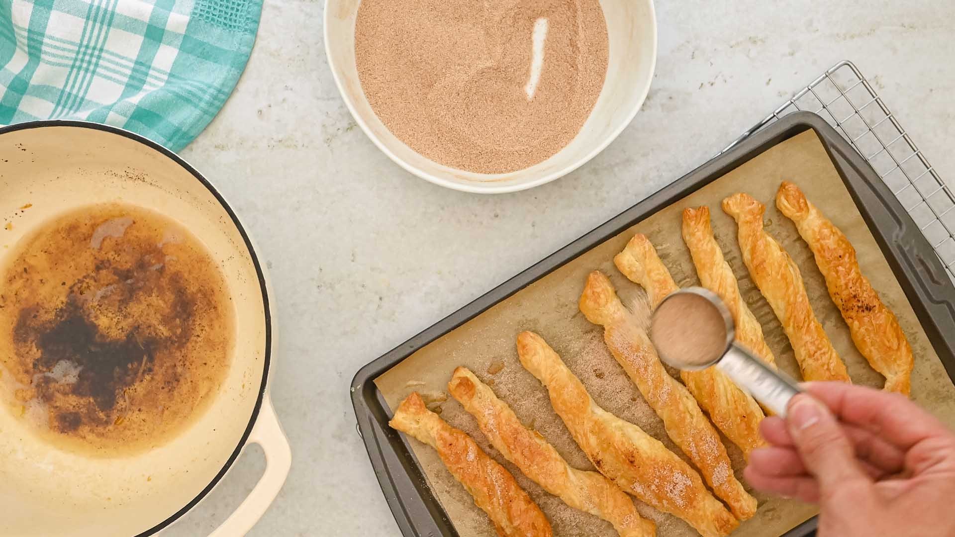 cinnamon sugar dusted over churros