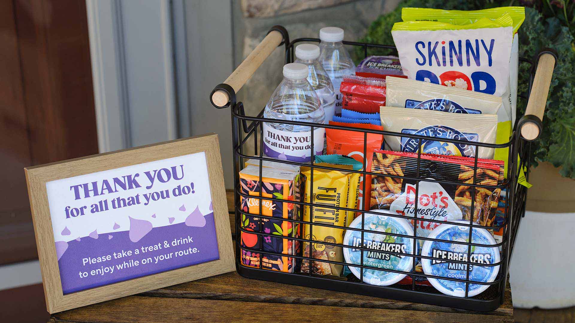 thank you basket filled with hersheys sweet and salty snacks, water bottles, and tissues