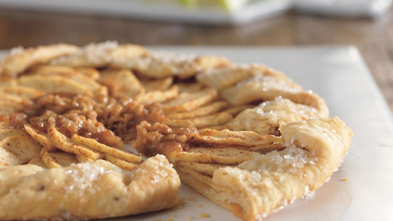 Hersheys Fresh Apple and Toffee Tart on a white cutting board