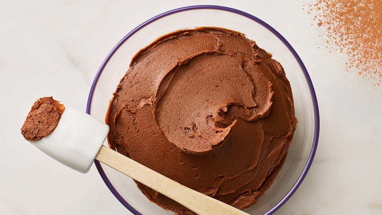 glass bowl of cocoa frosting