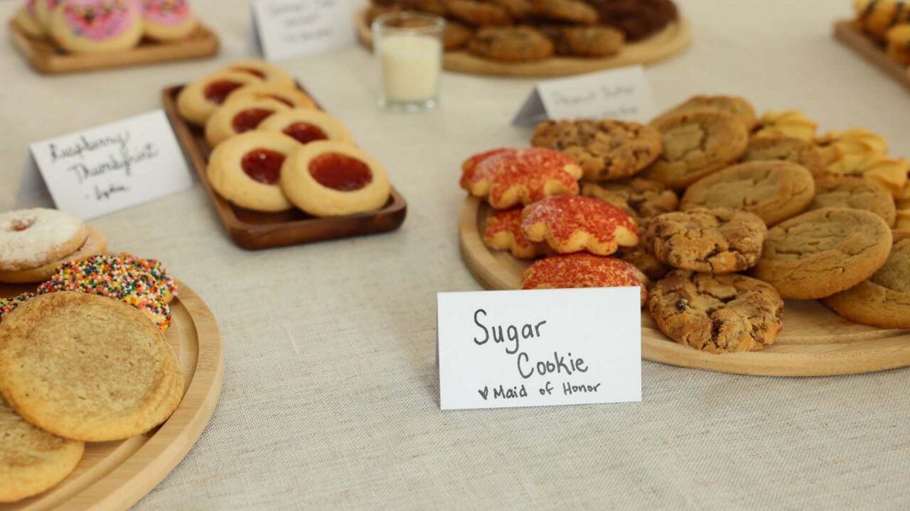 close up of a flavor label paired with an assortment of plated cookies