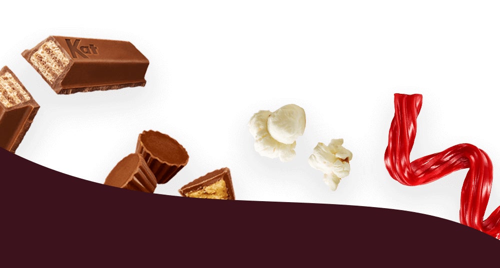 assorted wrapped and unwrapped hersheys candies and salty snacks