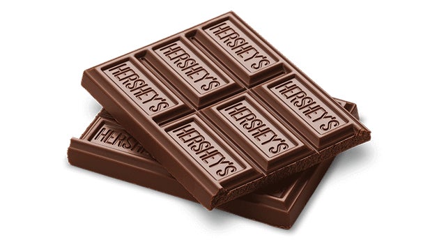 hersheys milk chocolate candy bar split in half and stacked
