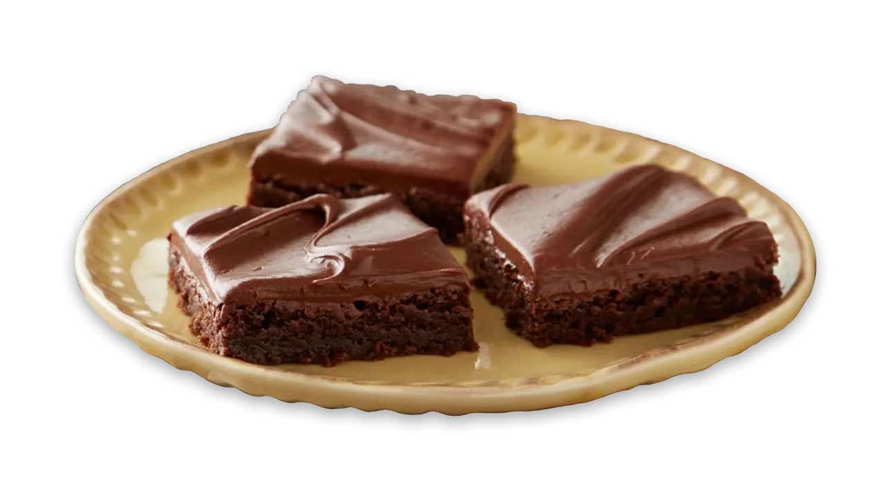 plate with brownie squares topped with hersheys cocoa frosting